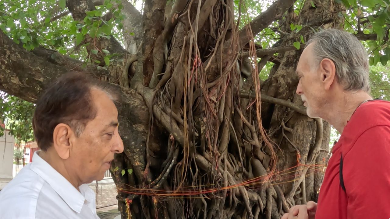 Krishna Das and Dr. Mungali beside a sacred banyan tree in India